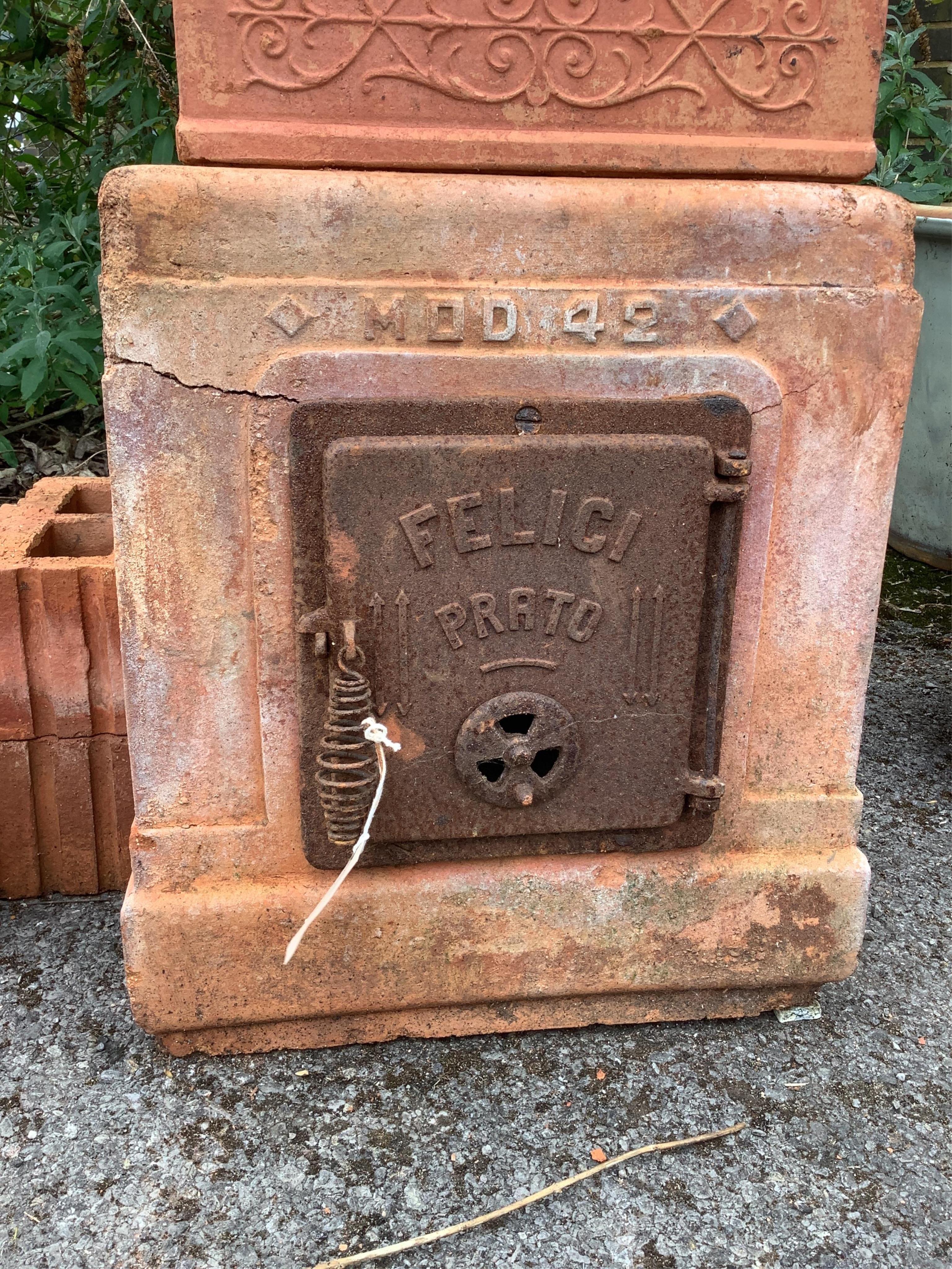 An Italian Felici Prato terracotta sectional garden stove, height 141cm